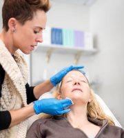 A Doctor Injecting Botox Into Facial Muscles
